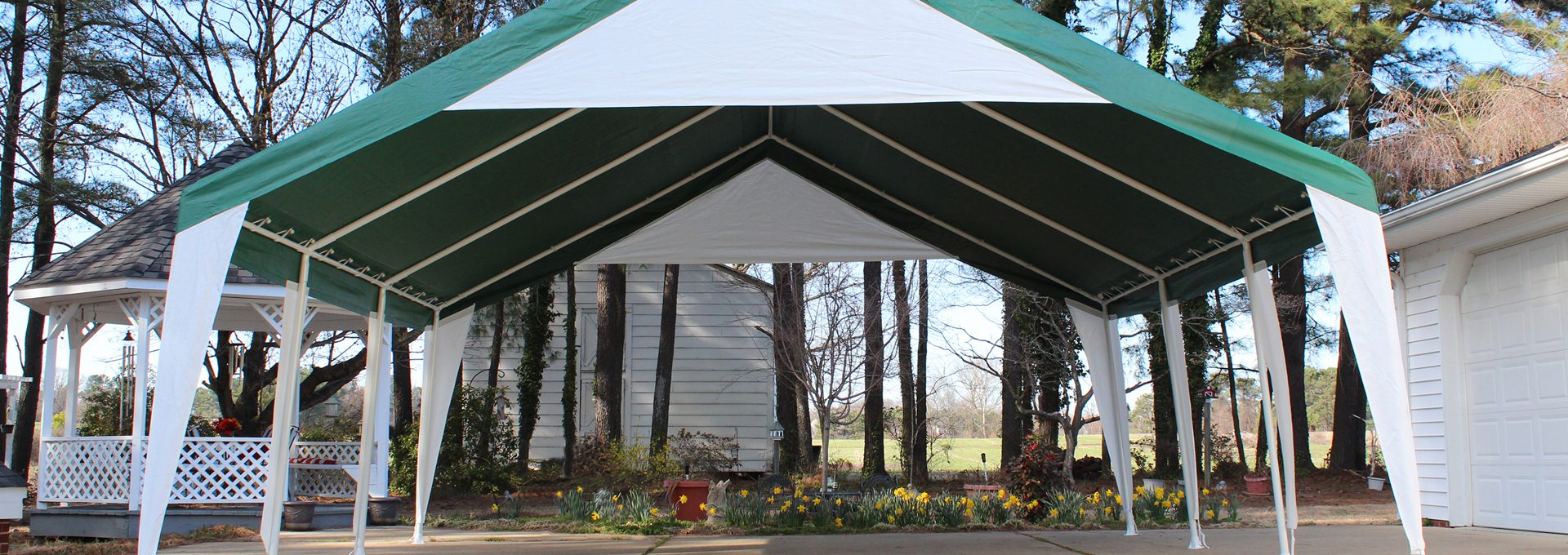 King Canopy event canopy with green and white cover